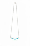 Necklace with turquoise beads on a white background