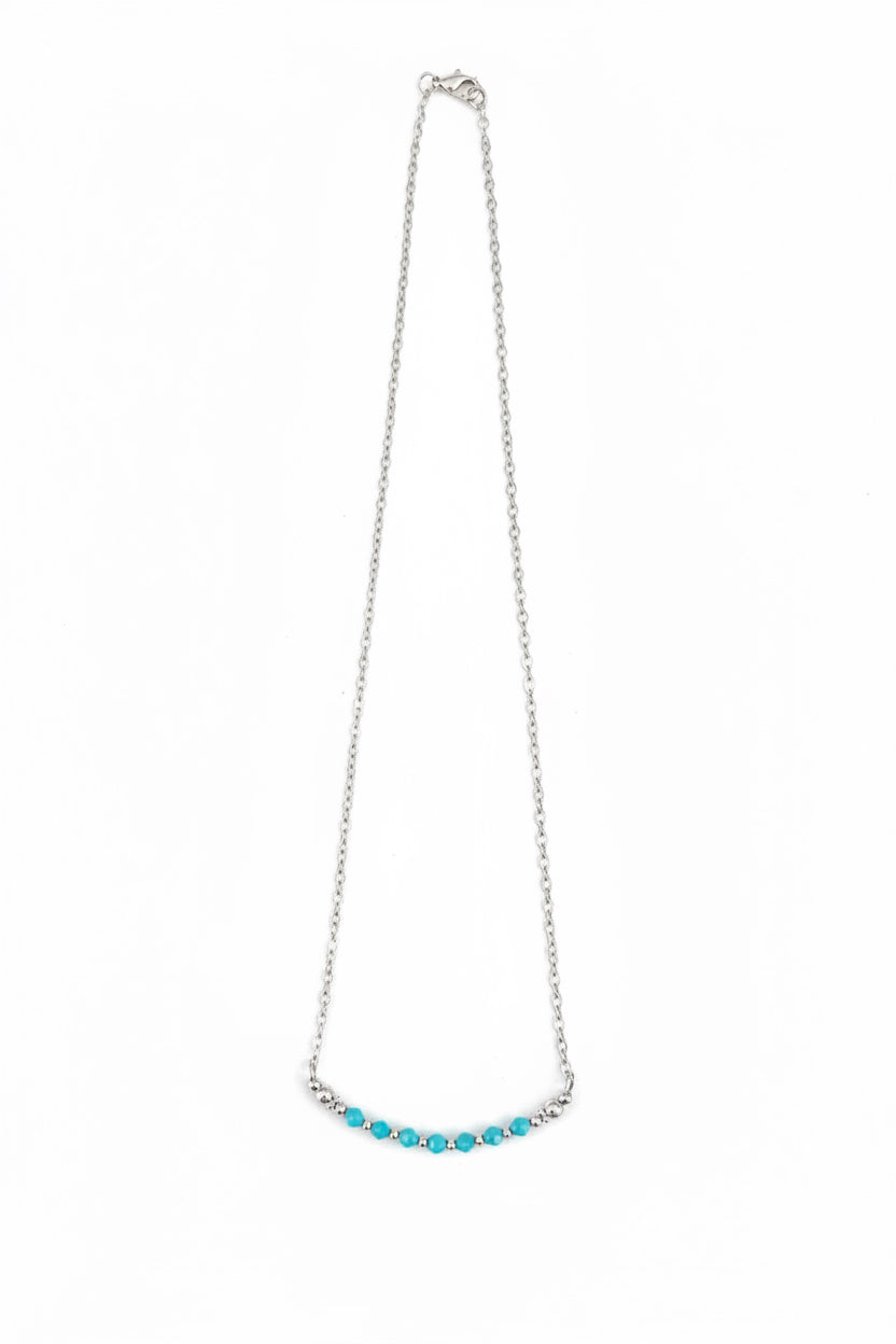 Necklace with turquoise beads on a white background
