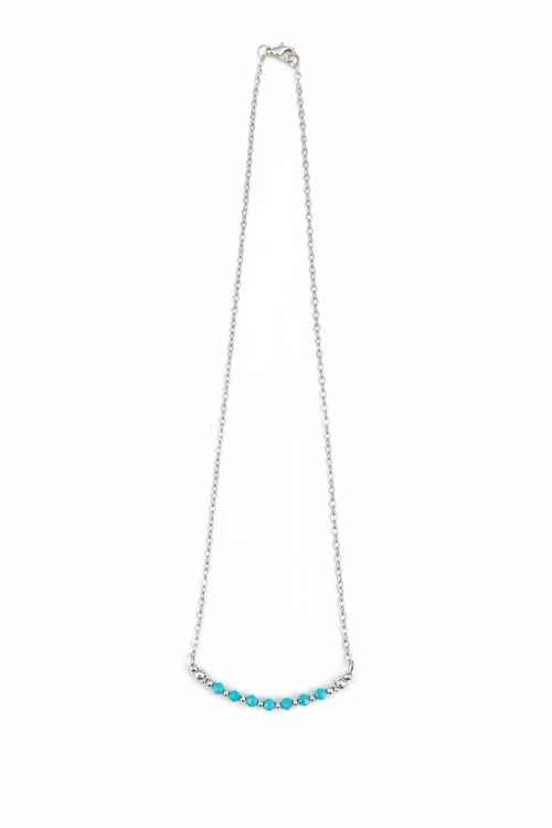 Necklace with turquoise beads on a white background