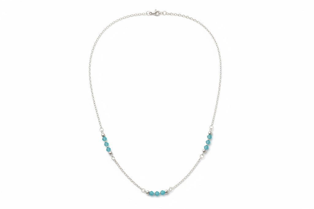 Blue Lagoon Necklace |  Delicate blue crystal beads along a strand of silver.