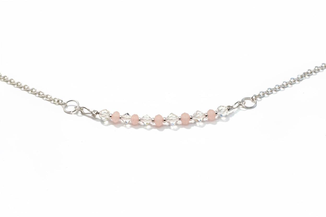 Blush Crystal Necklace - Soft pink and clear crystal beads suspended from a delicate silver-tone necklace