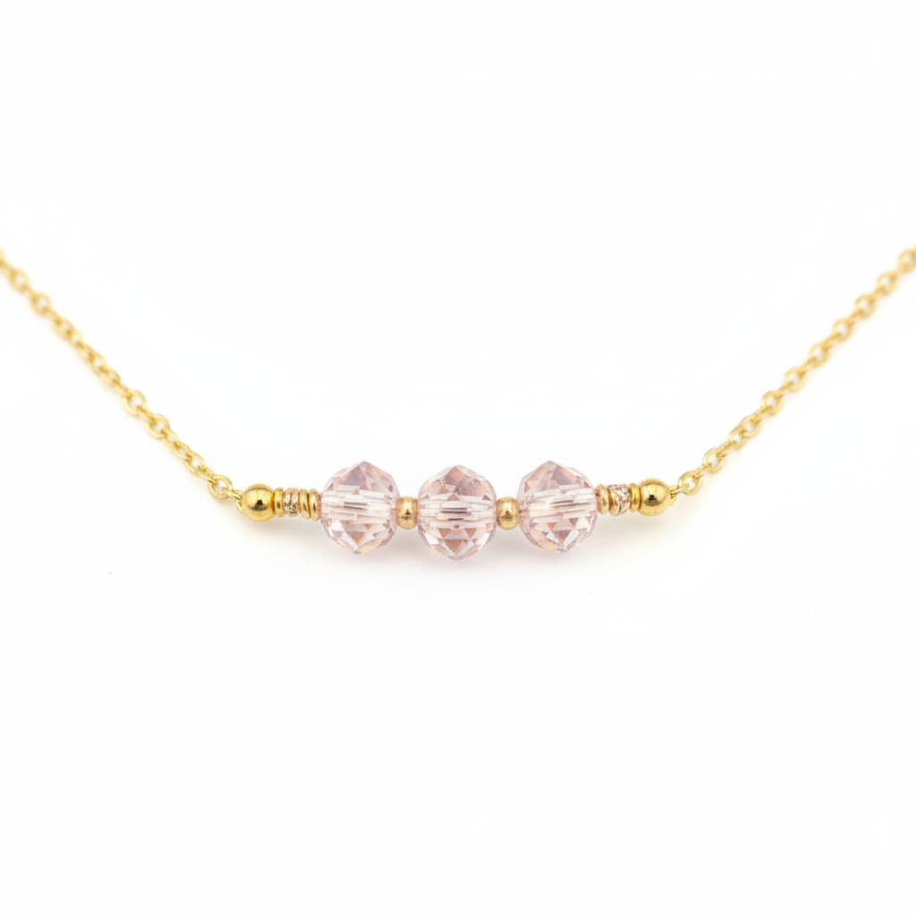 Blush Glow Necklace - Faceted blush-pink beads centered on a delicate gold chain