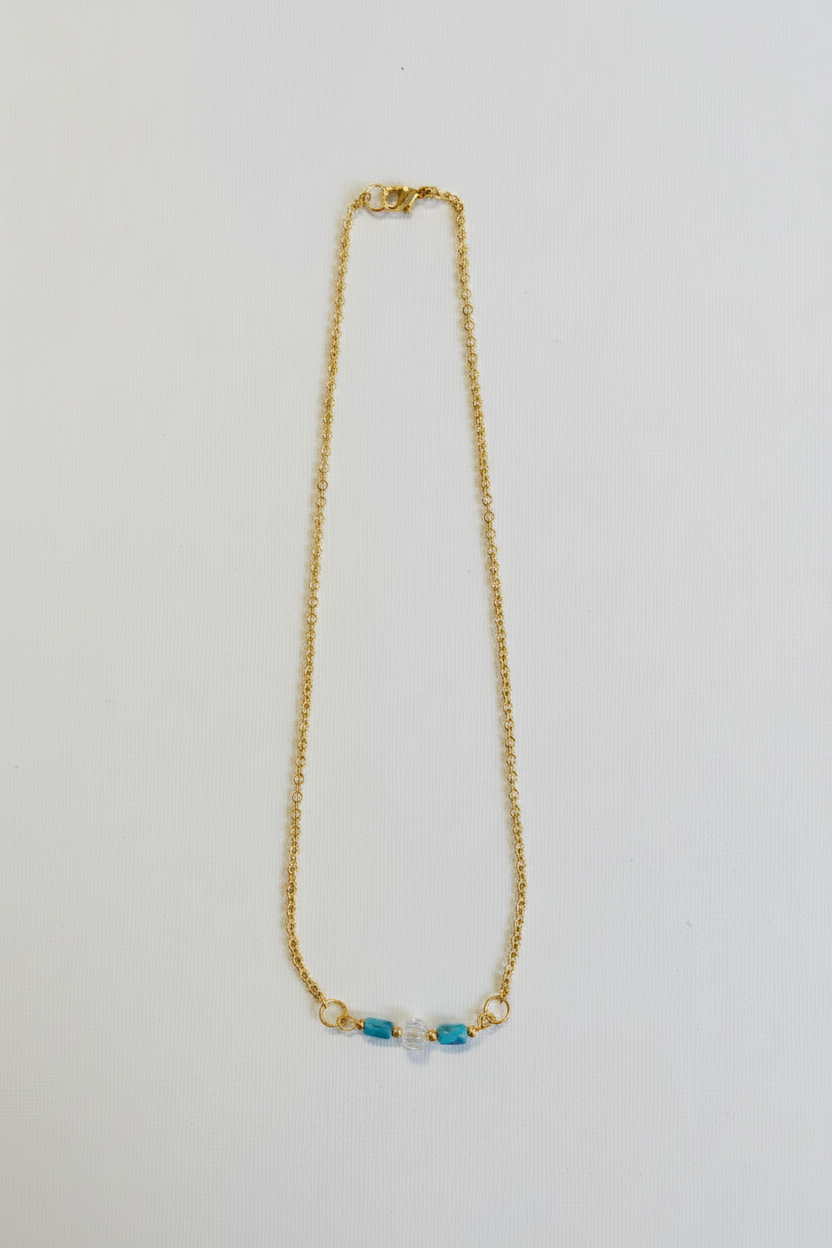 Clearwater Necklace - Blue and clear glass beads suspended from a silver chain.