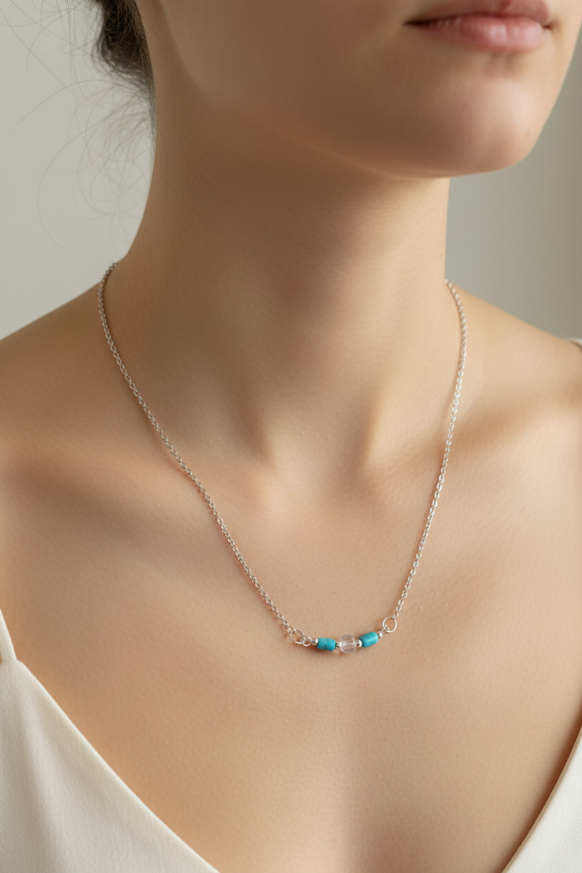 Clearwater Necklace - Blue and clear glass beads suspended from a silver chain.