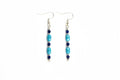 Earrings with blue and silver beads on a white background