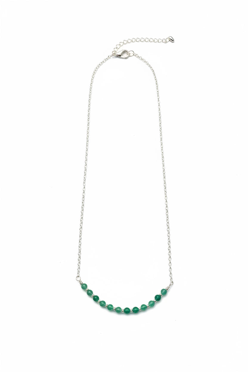 Necklace with green beads on a white background