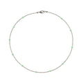 Necklace with small green beads on a white background