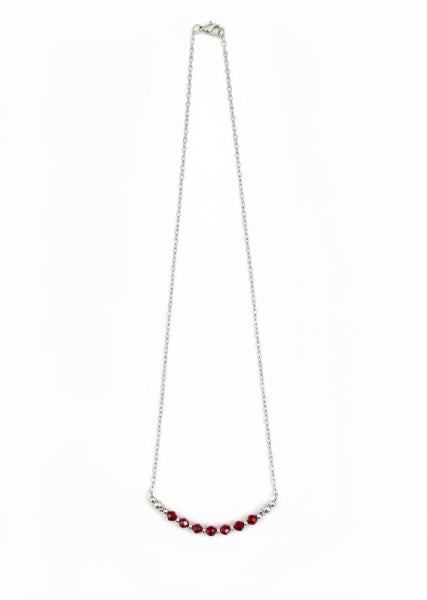 Garnet Glow Necklace - A delicate silver-tone necklace with deep garnet-red faceted beads for a romantic, elegant pop of color.