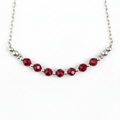 Necklace with red beads on a white background