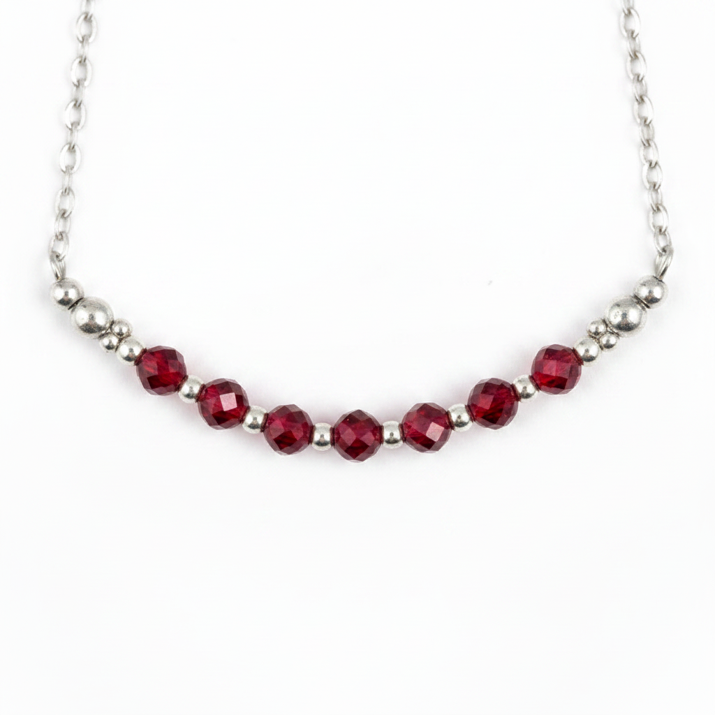 Necklace with red beads on a white background