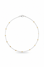 Gilded Thread Necklace | Gold cube beads spaced along a strand of silver.