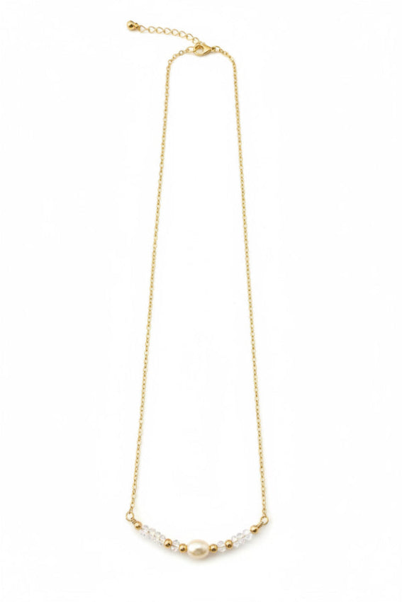 Gold necklace with pearls on a white background