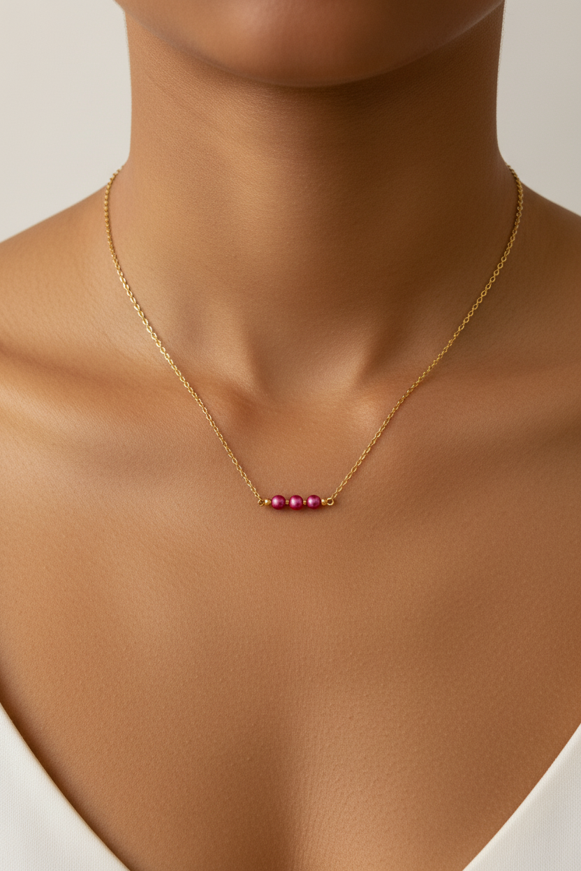 Gold necklace with pink beads