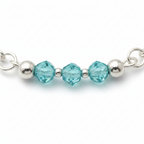 Blue Lagoon Necklace |  Delicate blue crystal beads along a strand of silver.