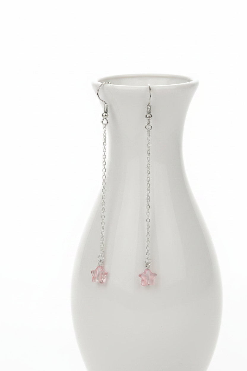 Blush Star Earrings - Delicate silver-tone chain earrings finished with soft blush pink stars for a whimsical celestial touch.