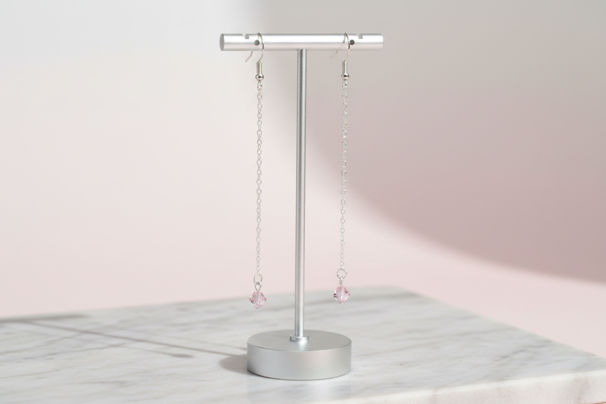 Blush Star Earrings - Delicate silver-tone chain earrings finished with soft blush pink stars for a whimsical celestial touch.