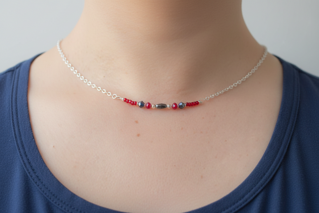 Crimson and Blue Necklace - A delicate silver-tone necklace with red and deep blue bead accents for a festive, colorful pop of sparkle.