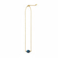 Midnight Tide Necklace - Rich blue focal bead suspended by gold-tone chain.