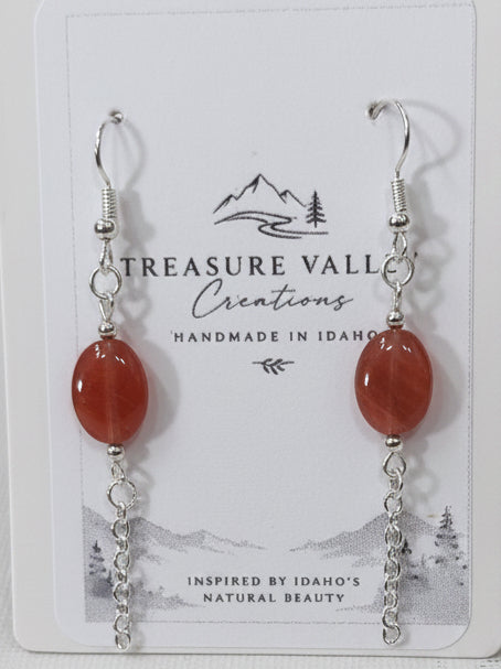 Carnelian Cascade Earrings - Silver-tone drop earrings with deep crimson beads, clear accents, and delicate chain fringe for a romantic pop of color.
