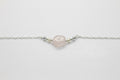 Rose Quartz Blossom Necklace - Carved rose quartz bead suspended from a delicate silver chain.