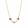 A gold chain necklace featuring three small round floral beads in white, pink, and green, arranged in an arc on a plain white background.