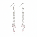 A pair of silver-toned dangle earrings with multiple chain strands and small faceted pink beads, shown on a clean white background.