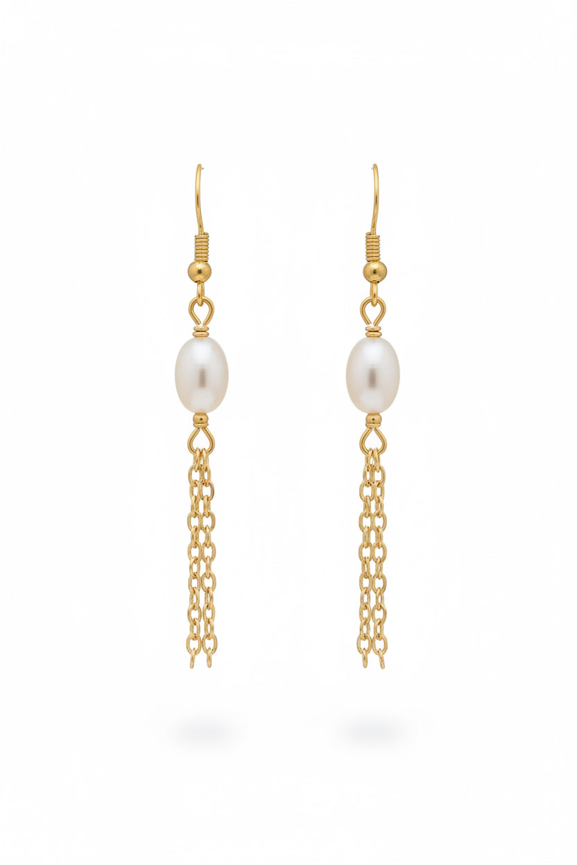A pair of gold dangle earrings with a white freshwater pearl and a dangling chain, shown on a plain white background.
