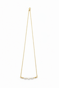 A delicate gold necklace featuring three luminous ivory pearls. Elegant, timeless, and handcrafted for effortless everyday beauty.&nbsp;