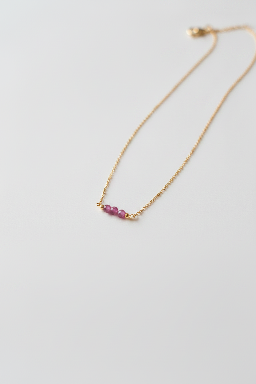 Necklace with pink beads on a white background