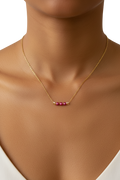 Gold necklace with pink beads