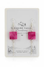 A pair of dangle earrings with square pink marbled beads and silver chain drops, displayed on a white Treasure Valley Creations card.