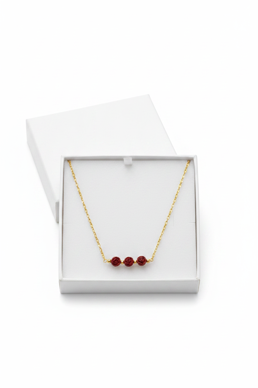 Rose Trio Necklace - Rose floral beads centered on a fine gold chain.