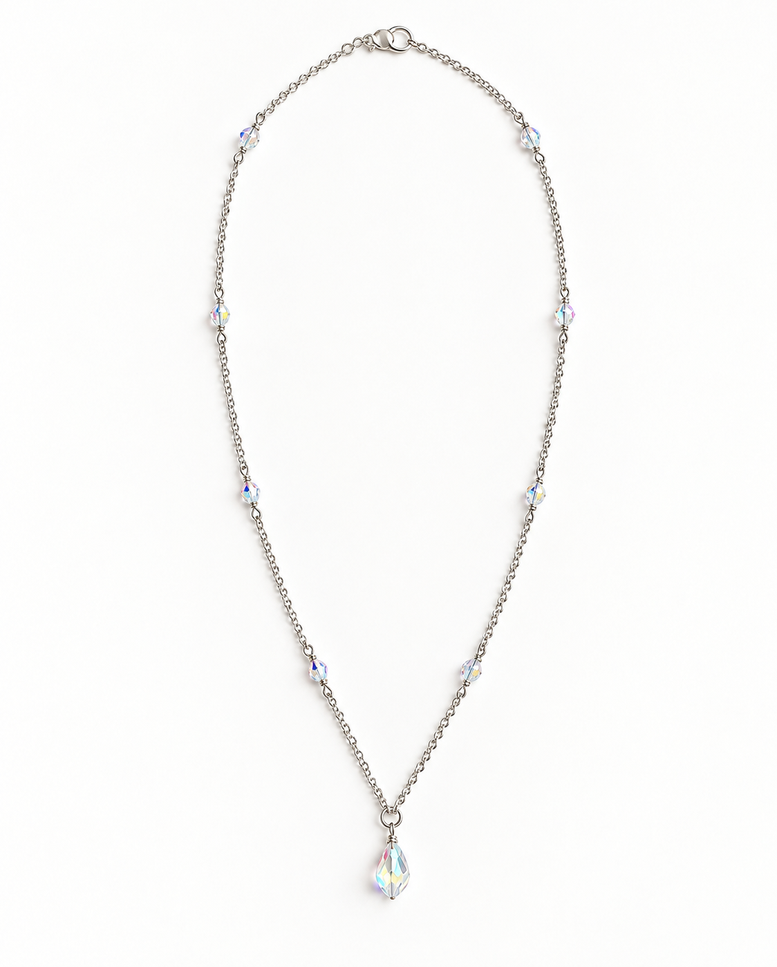 A silver-toned chain necklace with multiple iridescent crystal beads and a teardrop-shaped crystal pendant, displayed on a clean white background.