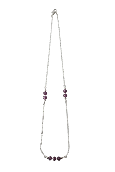 Necklace with purple beads on a white background