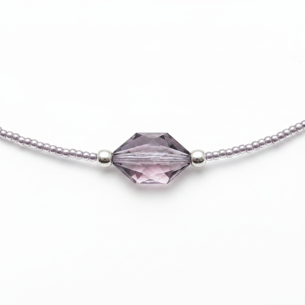 Necklace with a pale purple gemstone bead on a white background