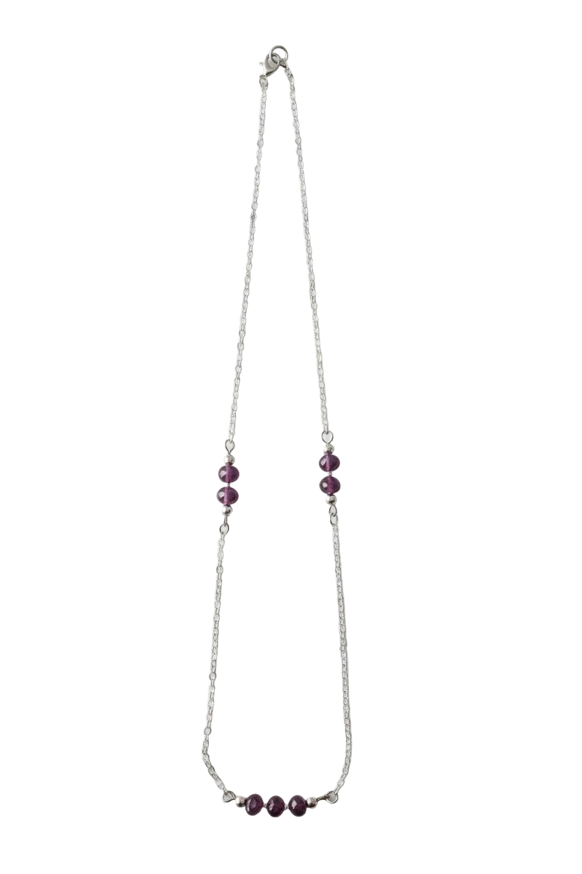 Necklace with purple beads on a white background