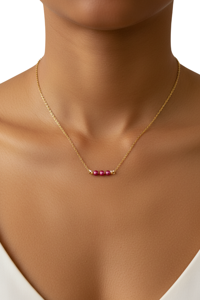 Gold necklace with pink beads