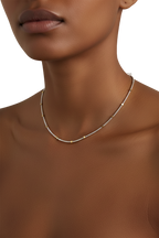 Necklace on a model with a neutral background