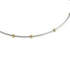 Gilded Thread Necklace | Gold cube beads spaced along a strand of silver.