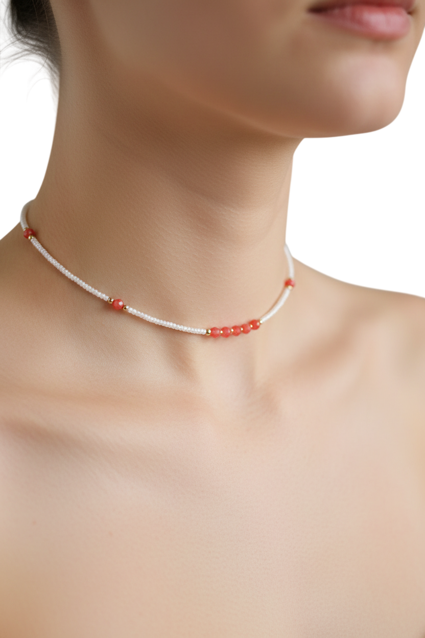 Coral Bloom Necklace | Coral gemstones along a strand of delicate ivory seed beads.