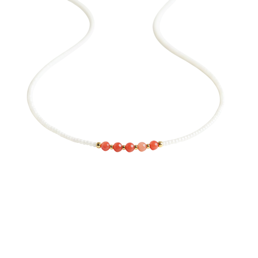 Coral Bloom Necklace | Coral gemstones along a strand of delicate ivory seed beads.